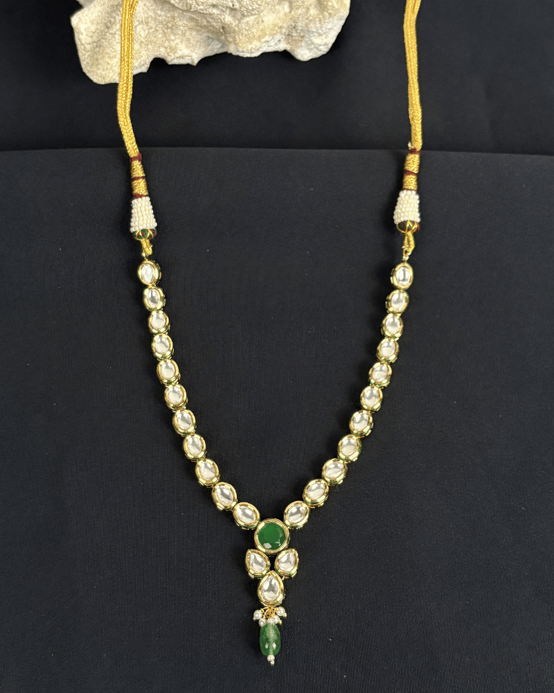 Eshanya Single Line Kundan Necklace With Emerald Drop